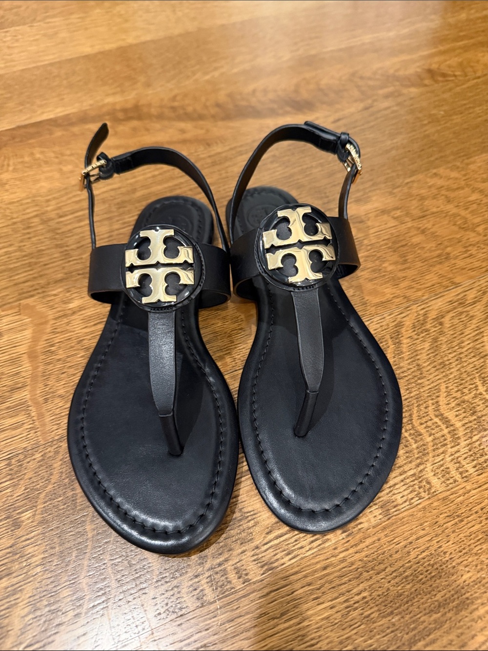 Tory Burch Black Leather Logo Thong Sandals with Gold Emblem